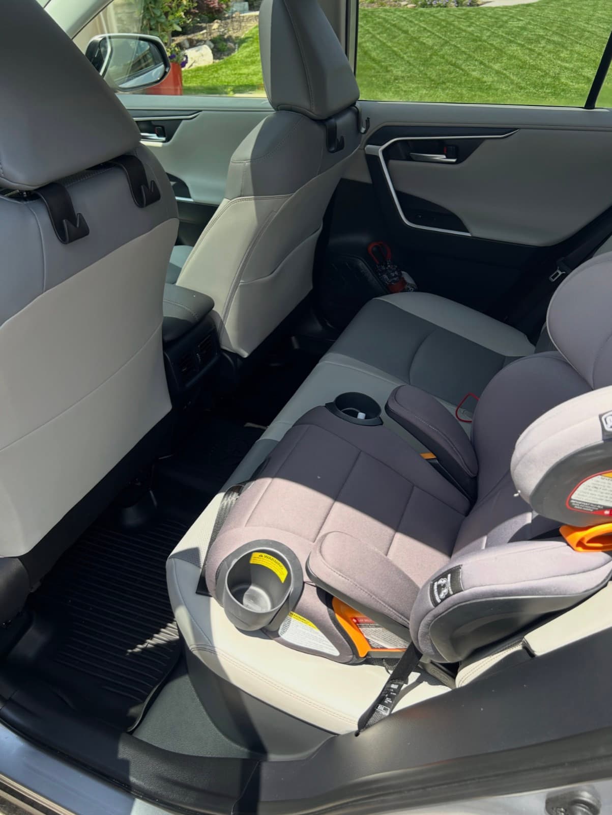 Back seat detail around a child car seat in a RAV4